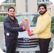 Man with flowers by car, symbolizing occasion, connection, and automotive lifestyle