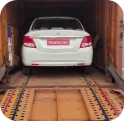 Car being transported on truck in India